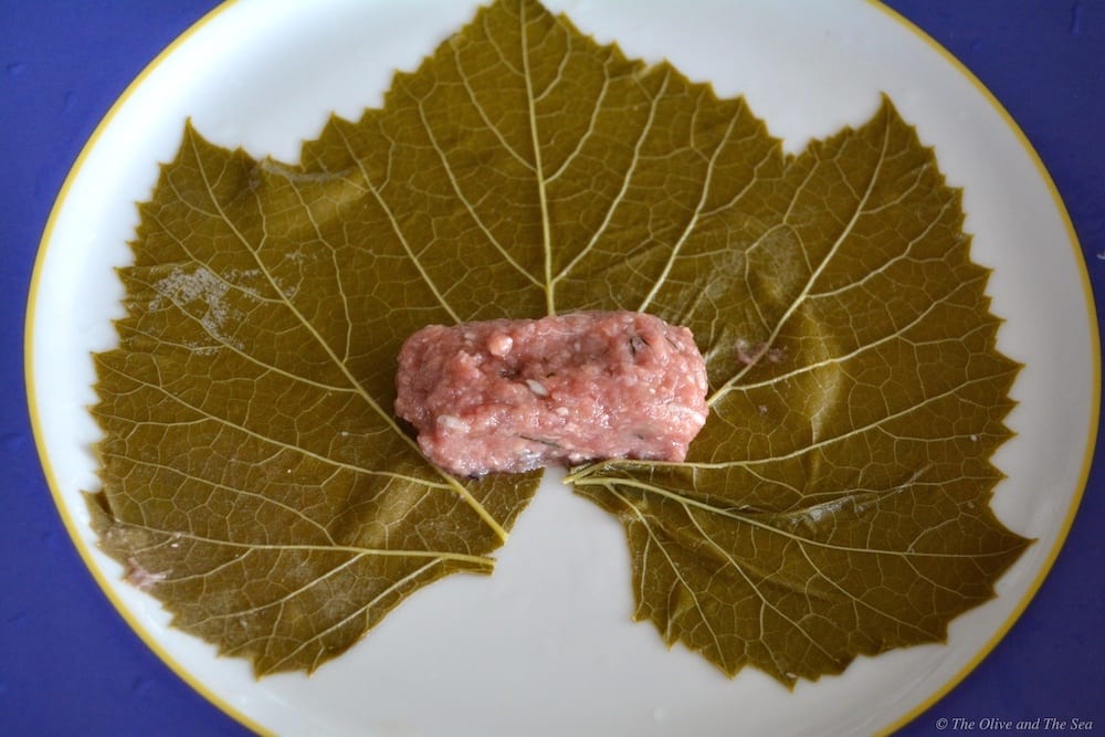Stuffing and rolling the grape leaves